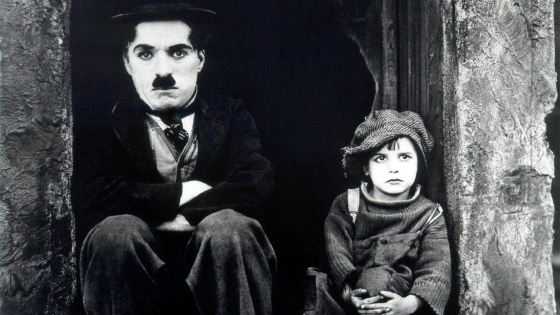 Charlie Chaplin Playing With A Child Background