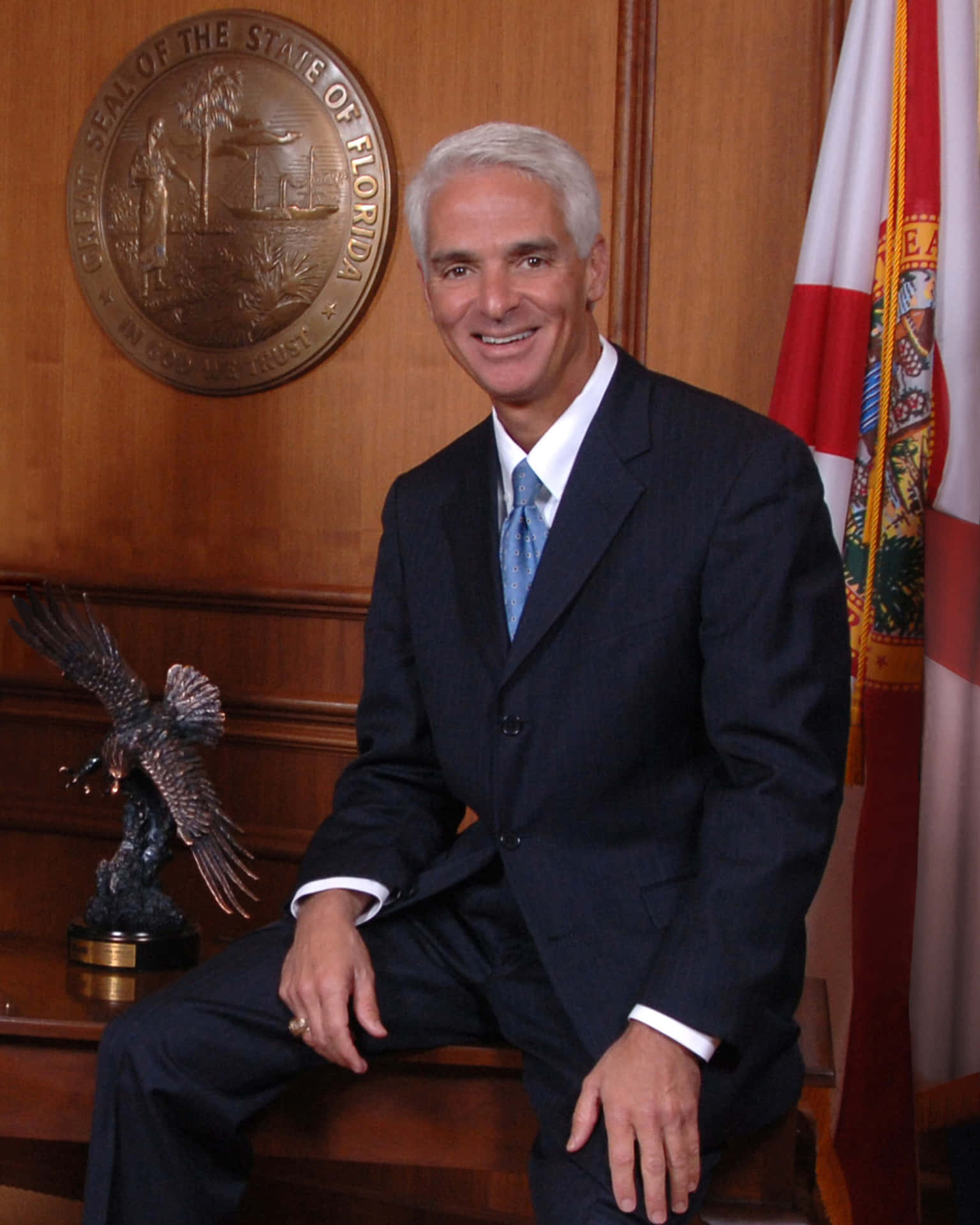 Charlie Crist On A Desk Background