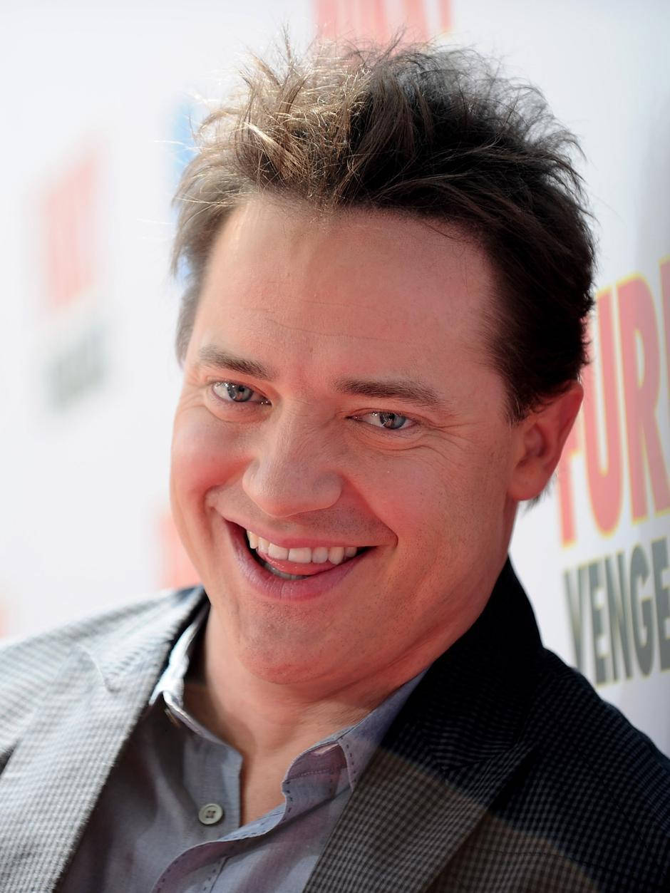 Charming Brendan Fraser In A Pensive Moment Background