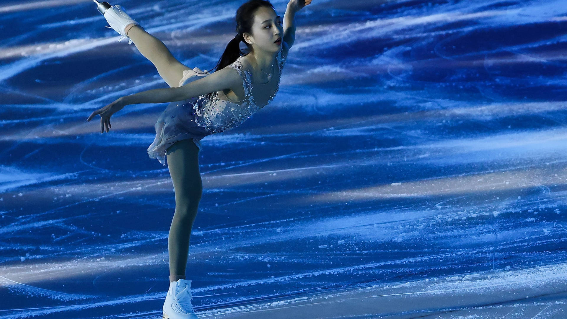 Charming Girl On Ice Skating Rink Background