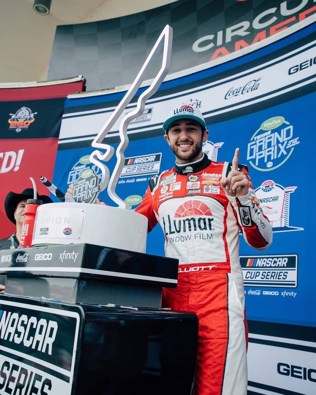 Chase Elliot Posing For The Press Background