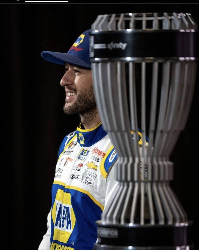 Chase Elliot Side Profile With Trophy Background