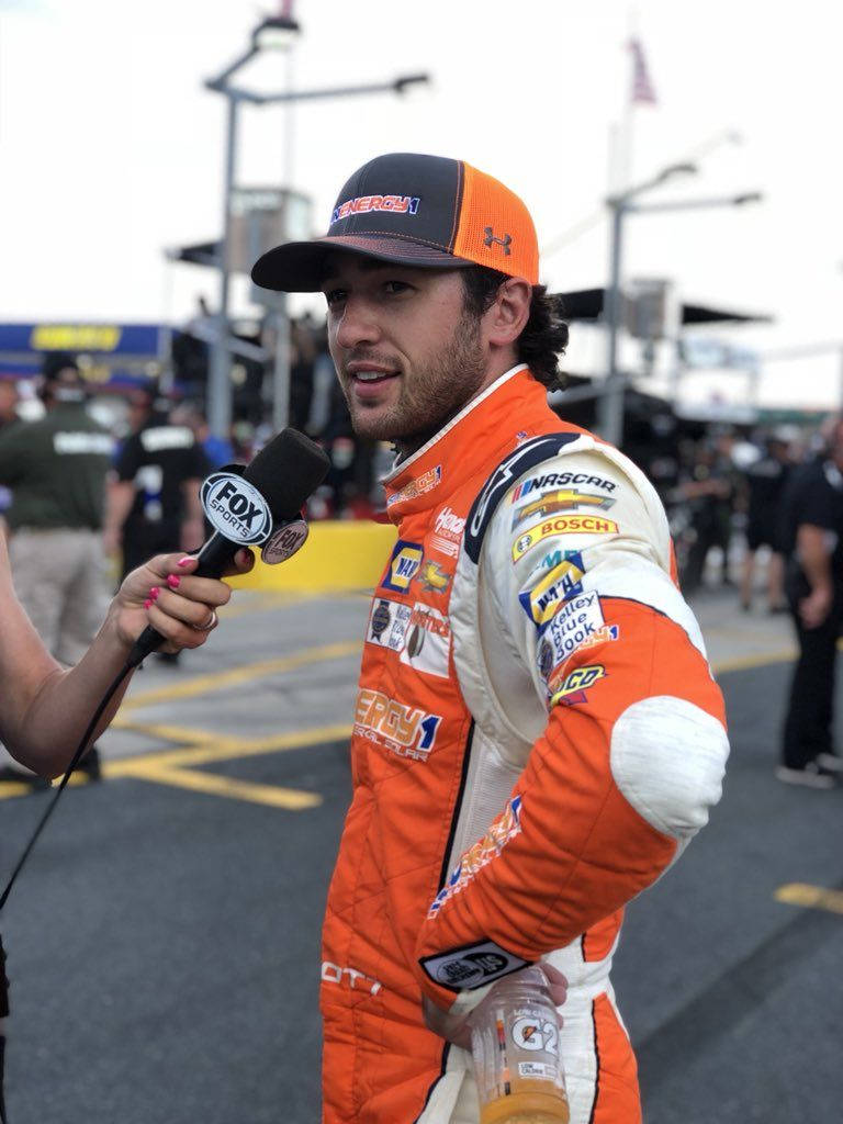 Chase Elliot Speaking During An Interview Background