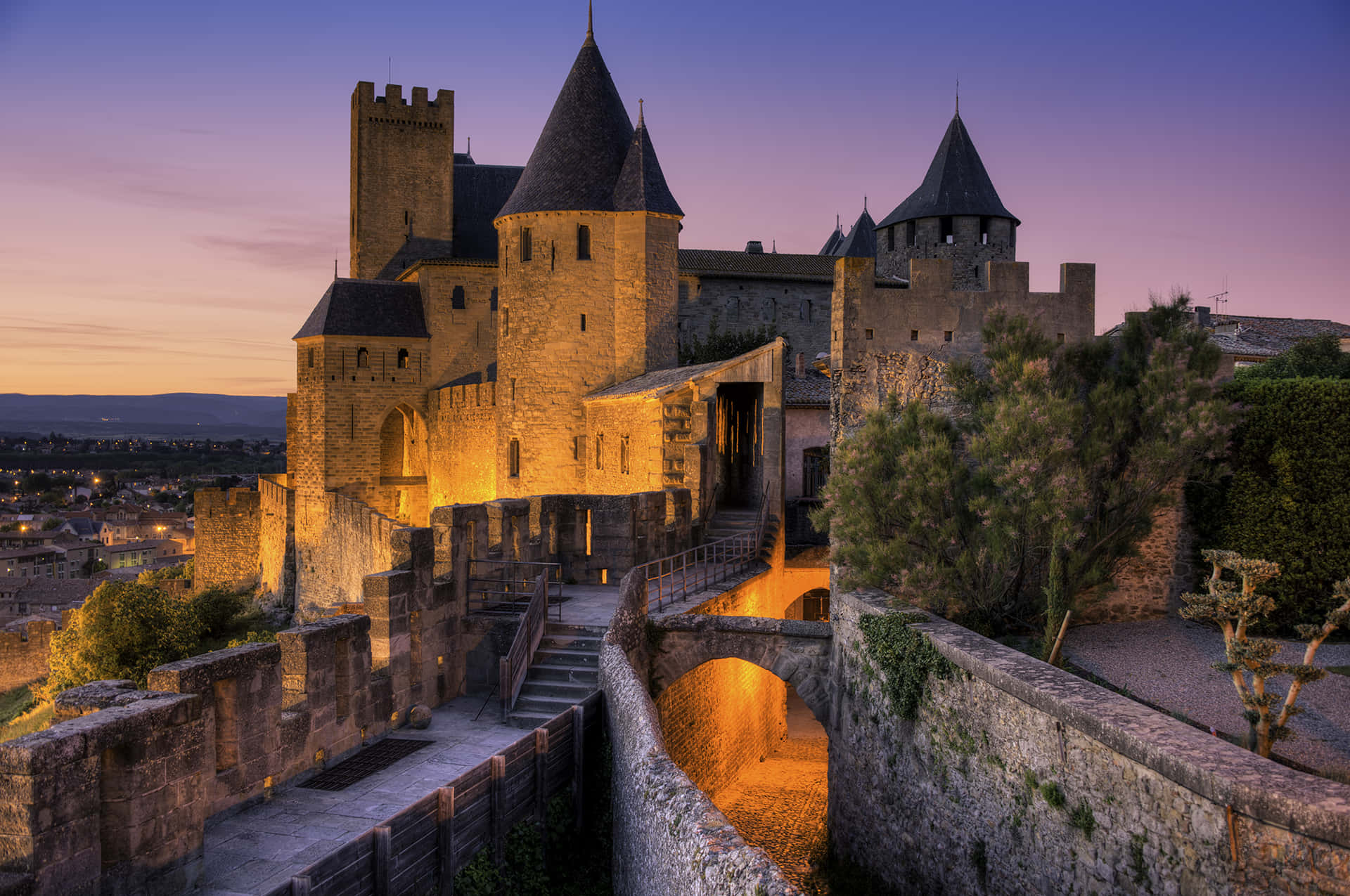Chateau Comtal In Carcassonne During Nighttime Background