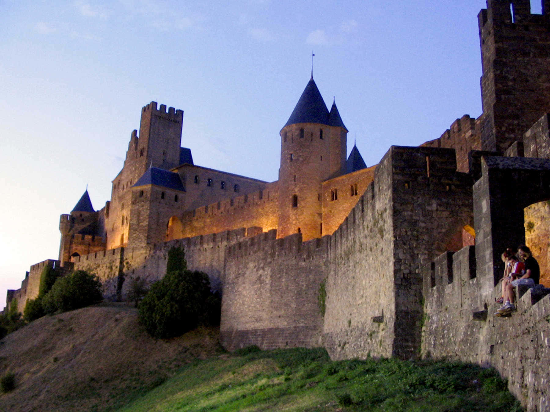 Chateau Comtal In Carcassonne With Lights Background
