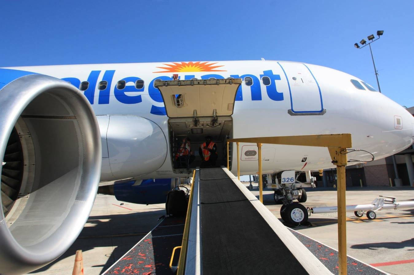 Checked Baggage Ready For Flight With Allegiant Air Background