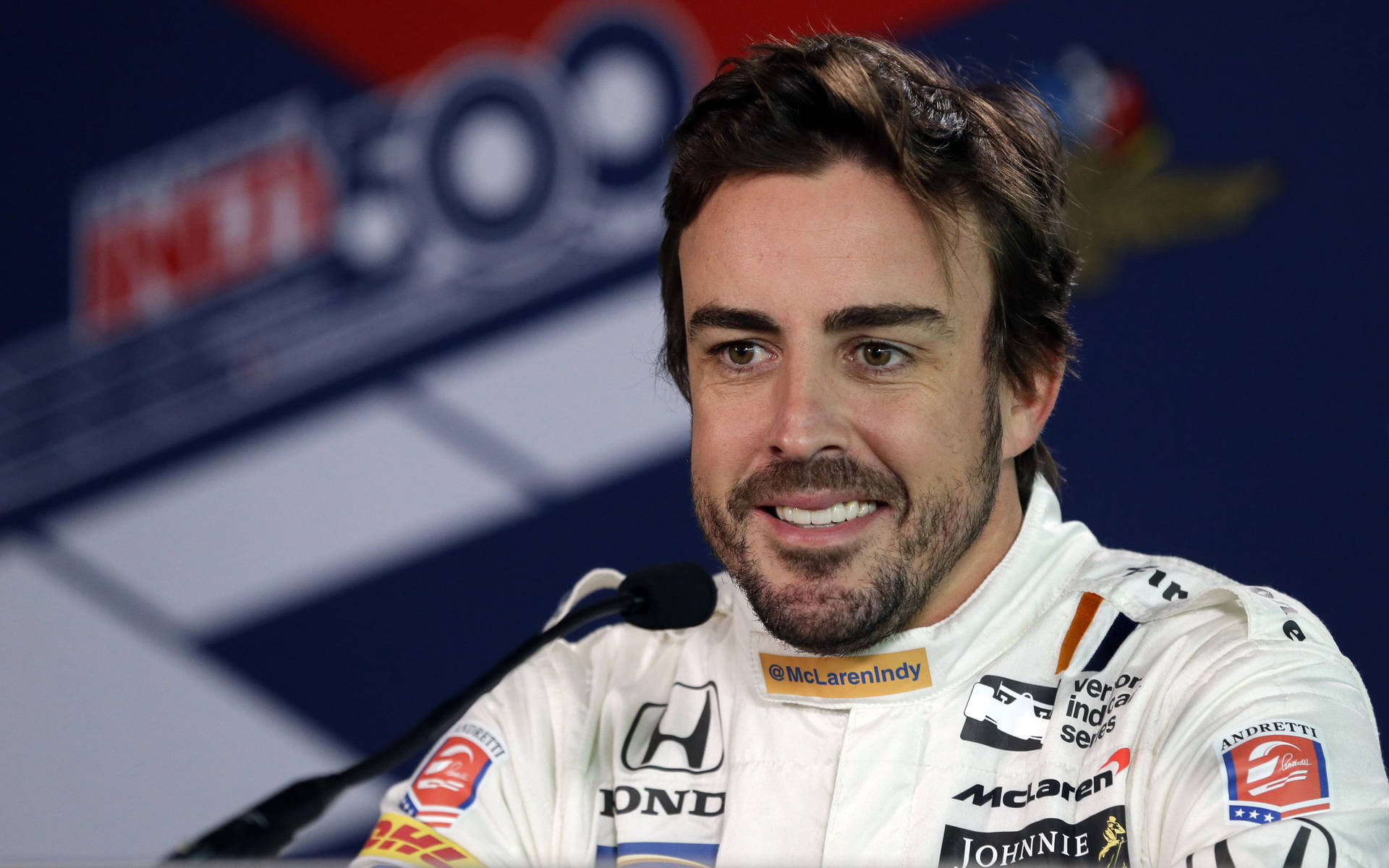 Cheerful Fernando Alonso Expressing Joy Background