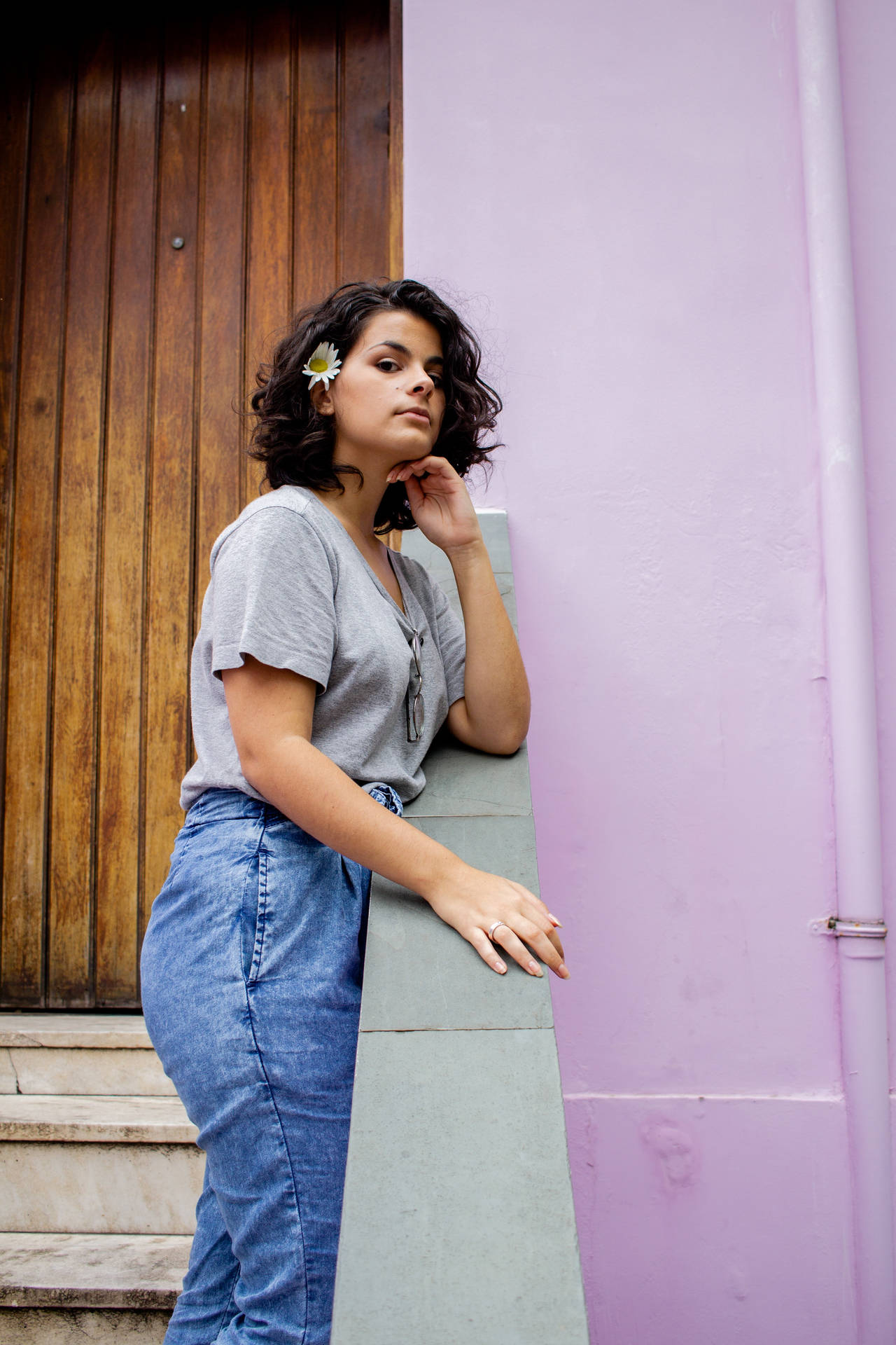 Cheerful Latina Girl By A Vintage Doorway Background