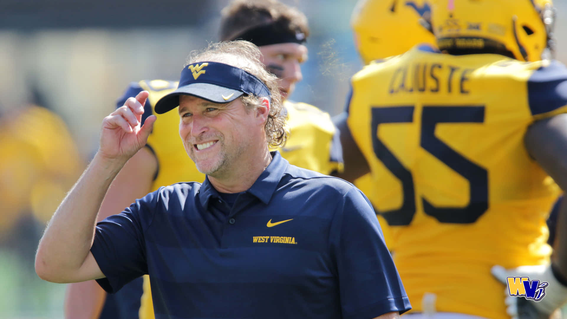 Cheering On The West Virginia Mountaineers Background