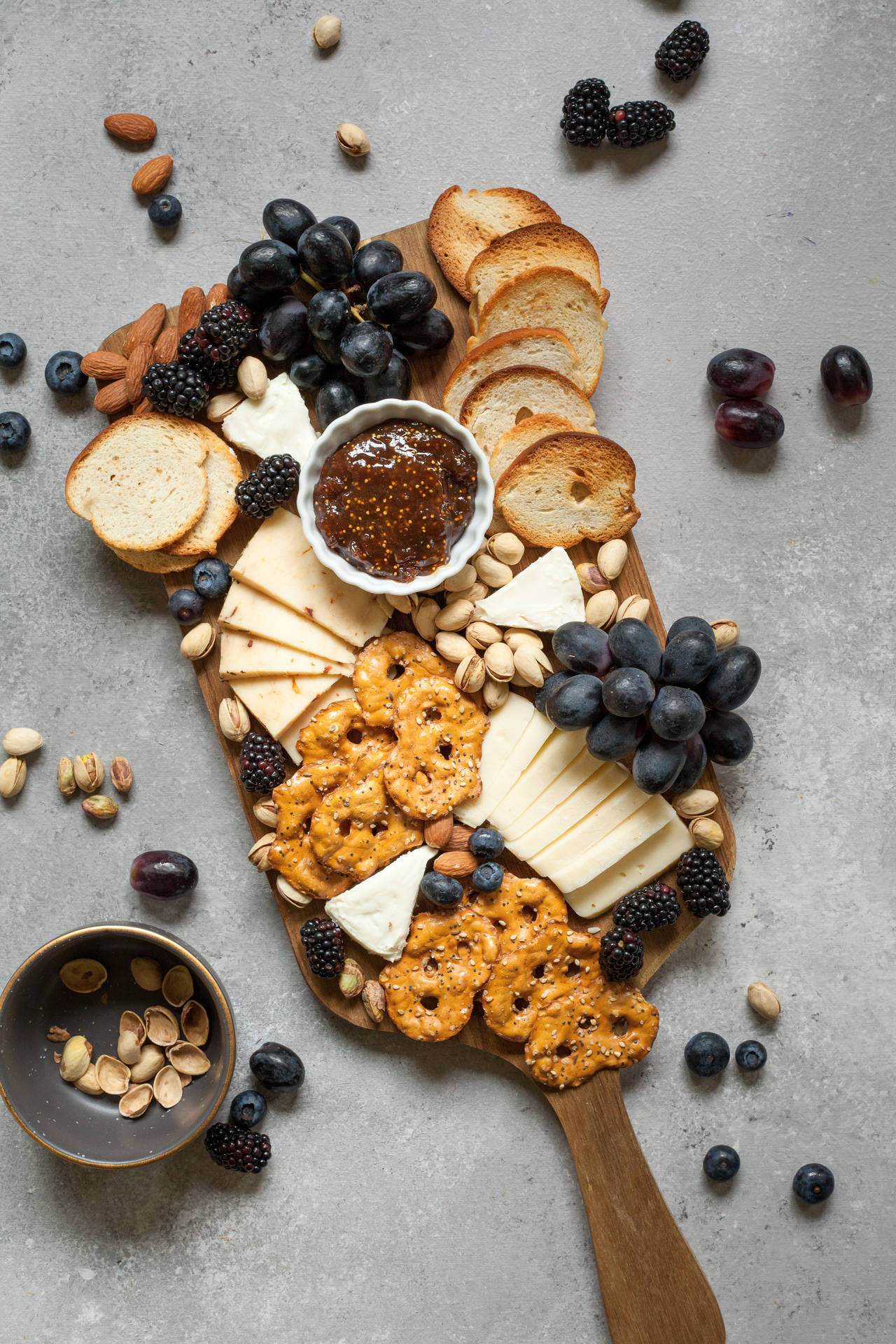 Cheese, Fruits, Pretzels On Platter Background