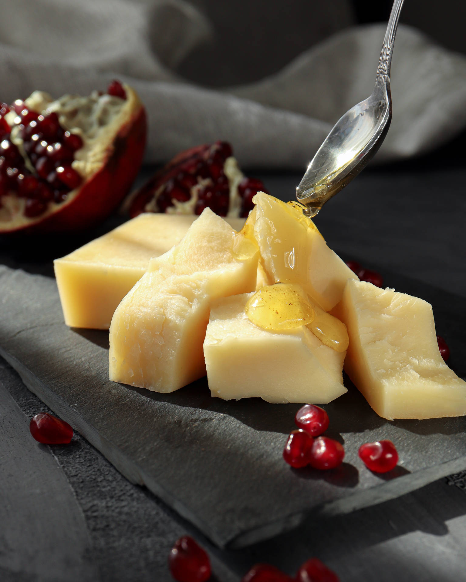 Cheese With Syrup And Pomegranate Background