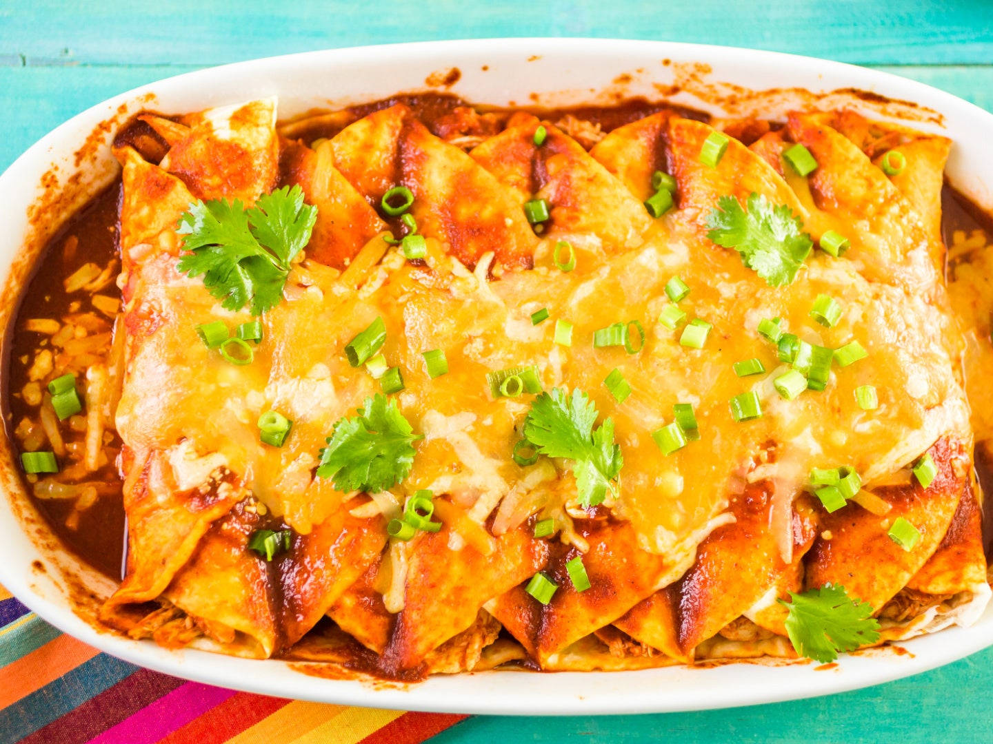 Cheesy And Savory Tray Of Enchiladas Background