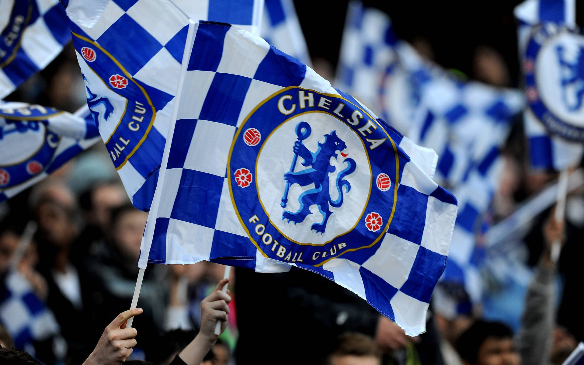 Chelsea Fc Fans Waving Flags Background