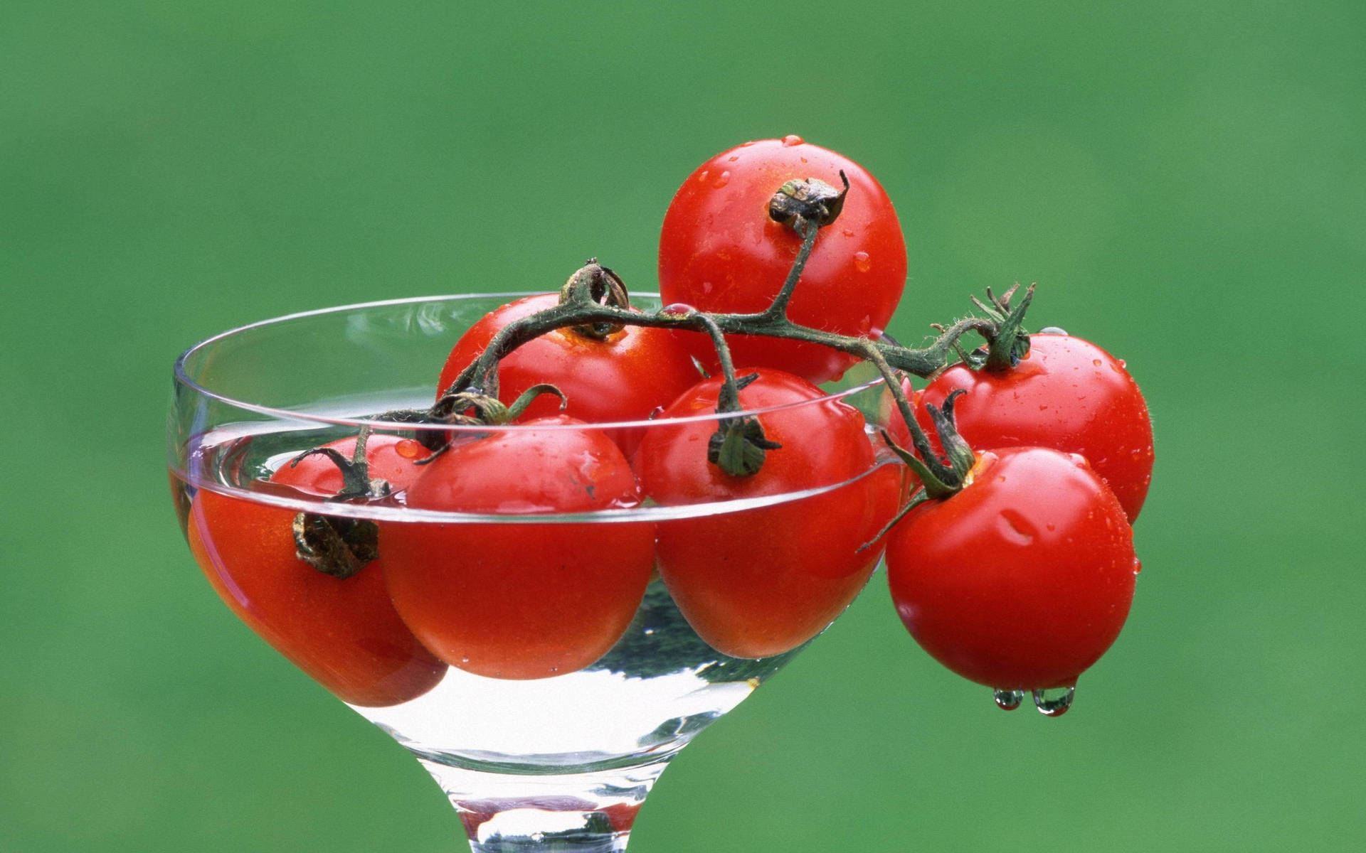 Cherry Tomato Fruits In Goblet Glass Background