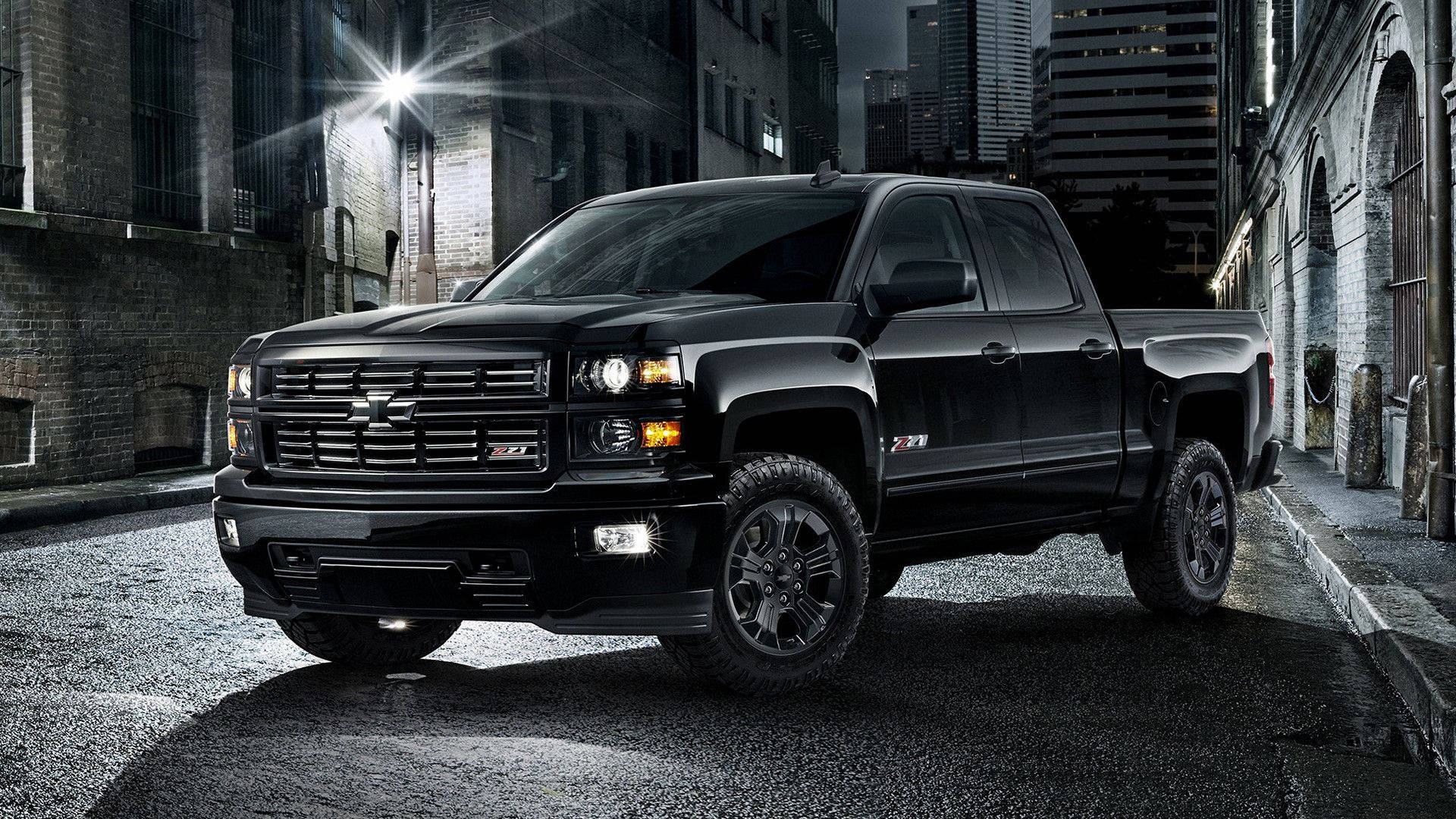 Chevrolet Silverado 1500 - A Black Truck Parked In A City Background