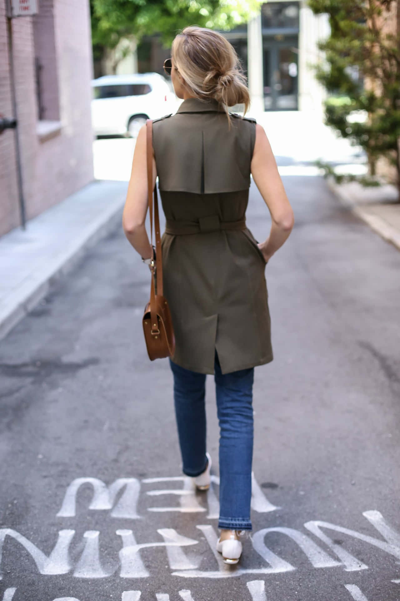 Chic Blonde Woman Showcasing Her Nicholas Kirkwood Flats Background