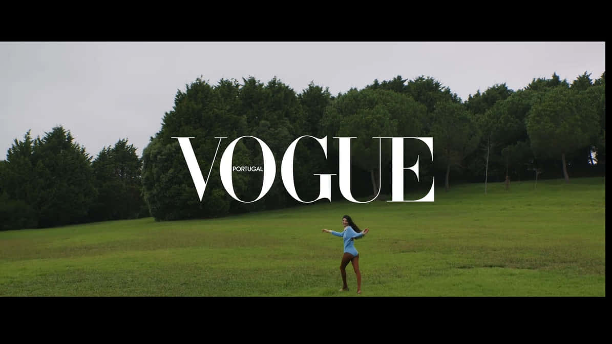 Chic Elegance Symbolized In Vogue Logo Background