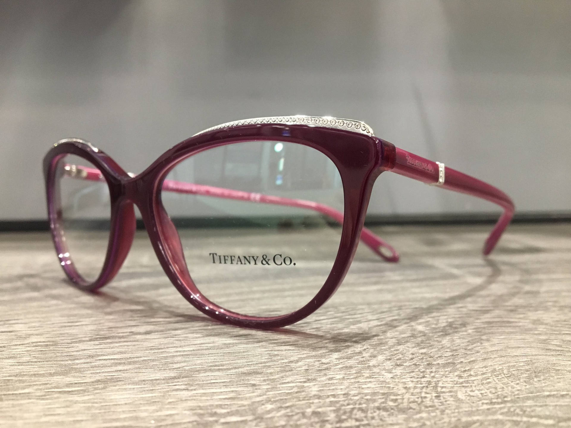 Chic Red Eyeglasses By Tiffany & Co. Background