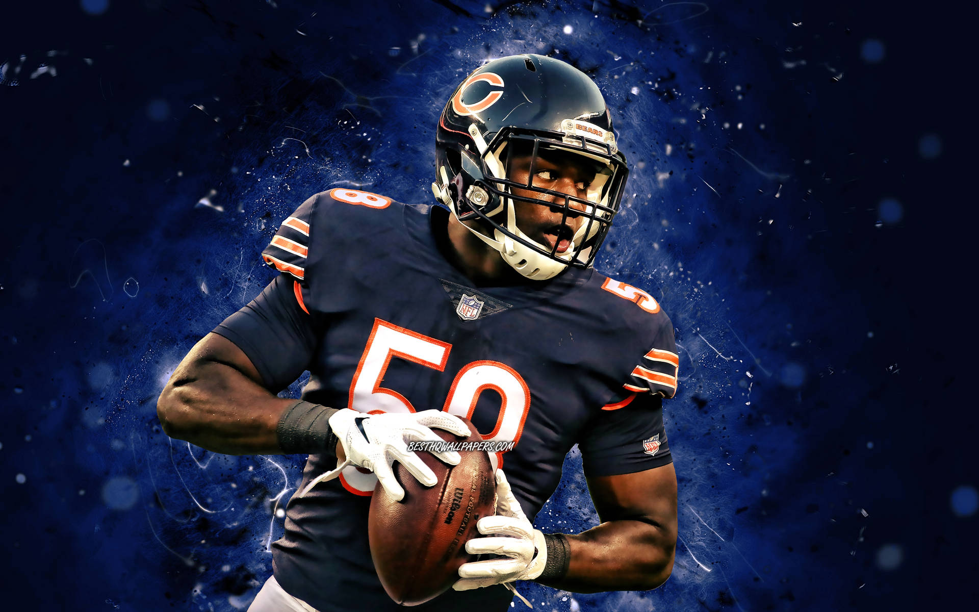 Chicago Bears Roquan Smith Holding A Ball Background