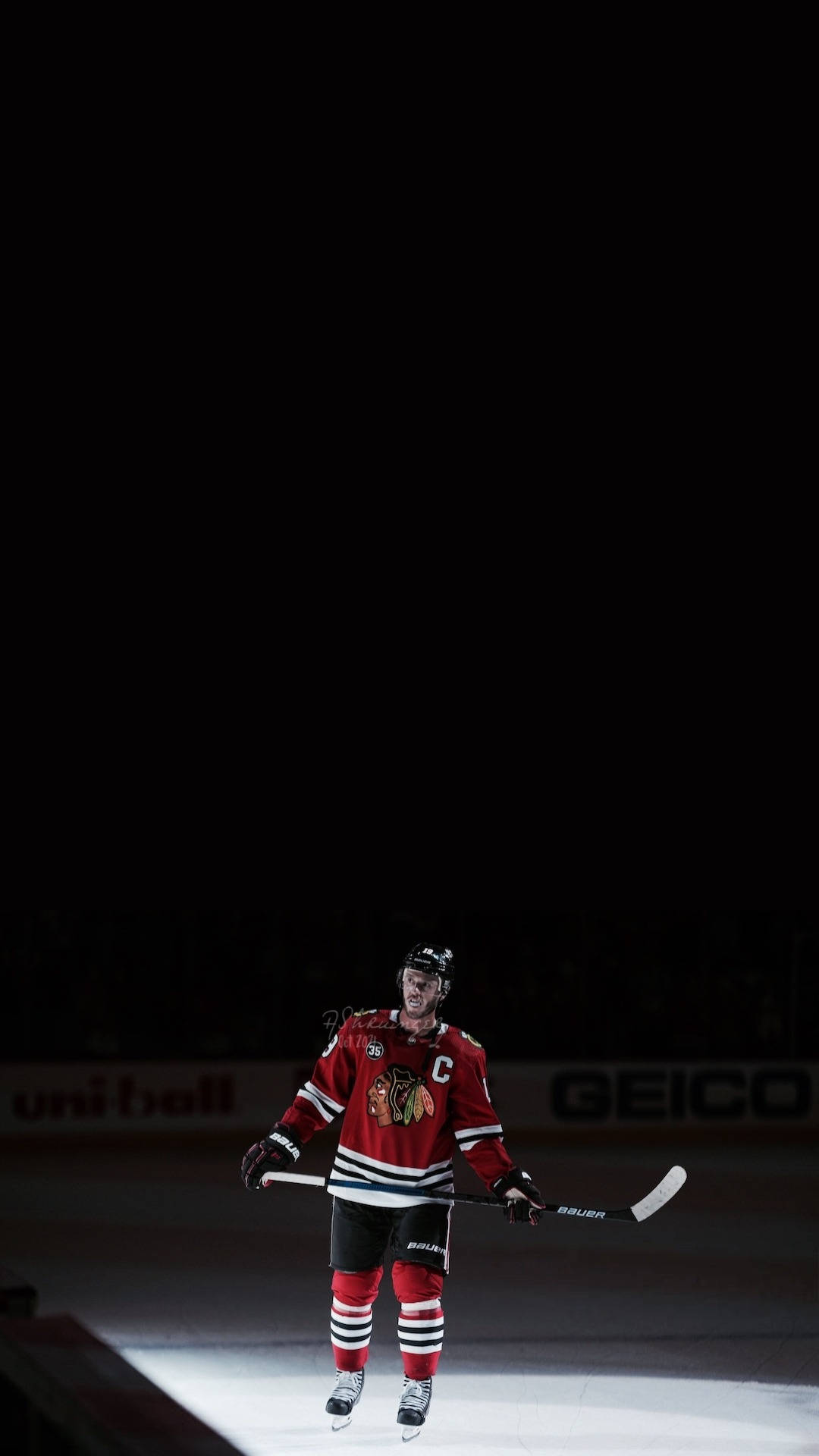 Chicago Blackhawks Captain, Jonathan Toews, In Action On The Ice. Background