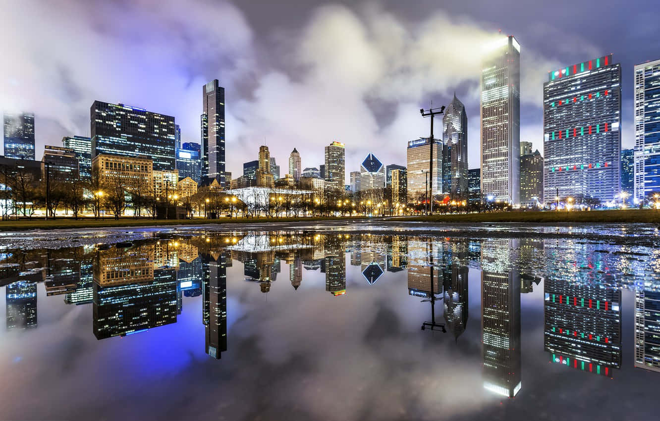Chicago Skyline Reflected In A Pond At Night Background