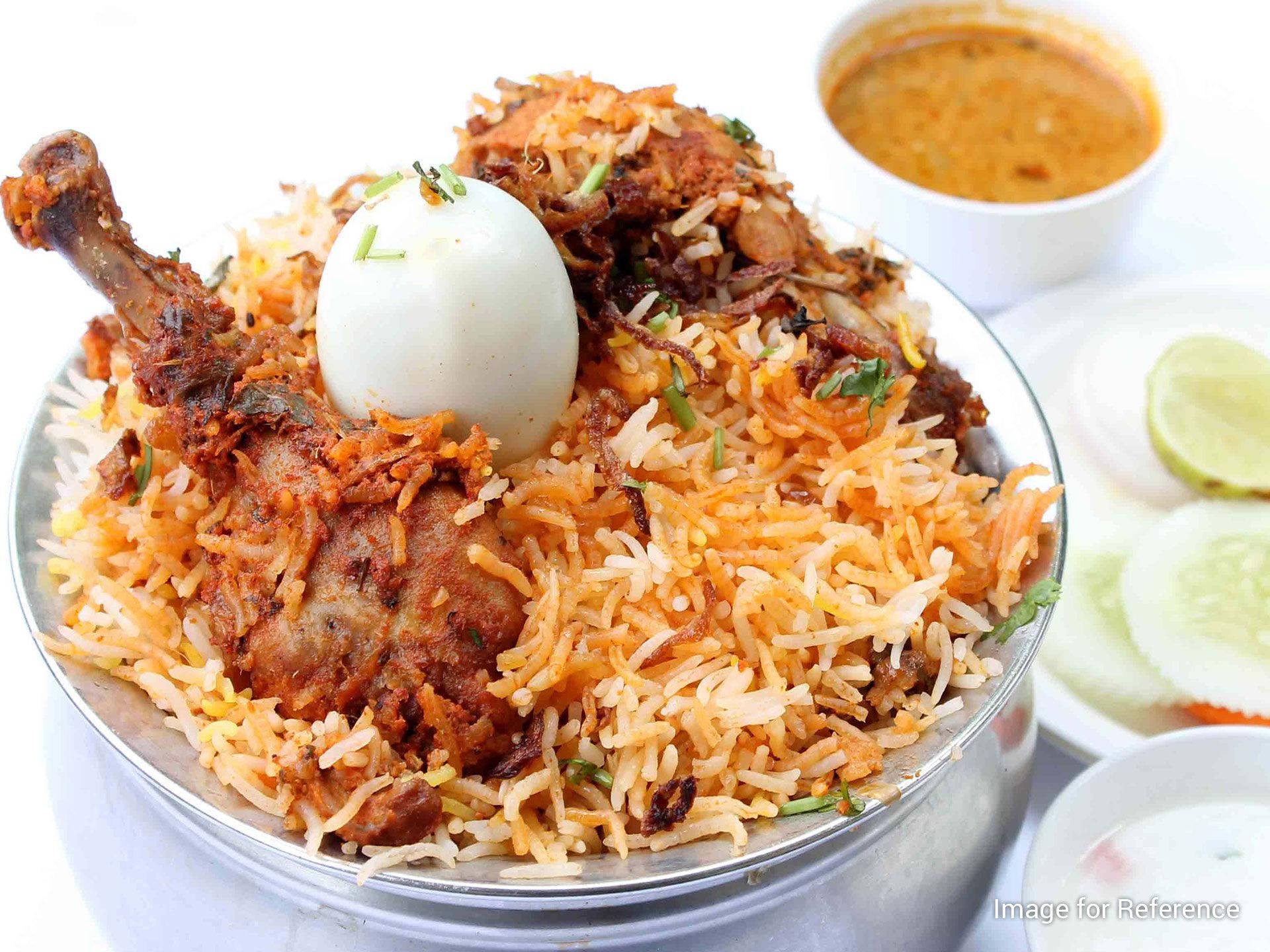 Chicken Biryani In Silver Saucepan Background