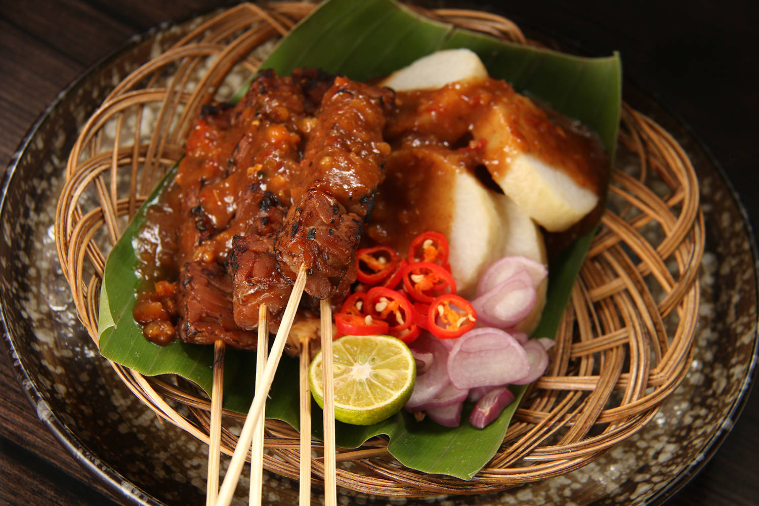 Chicken Satay Southeast Asian Dish On Rattan Platter Background