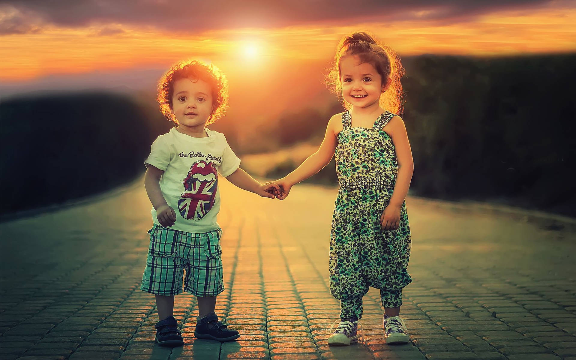 Children Holding Hands At Sunset Background