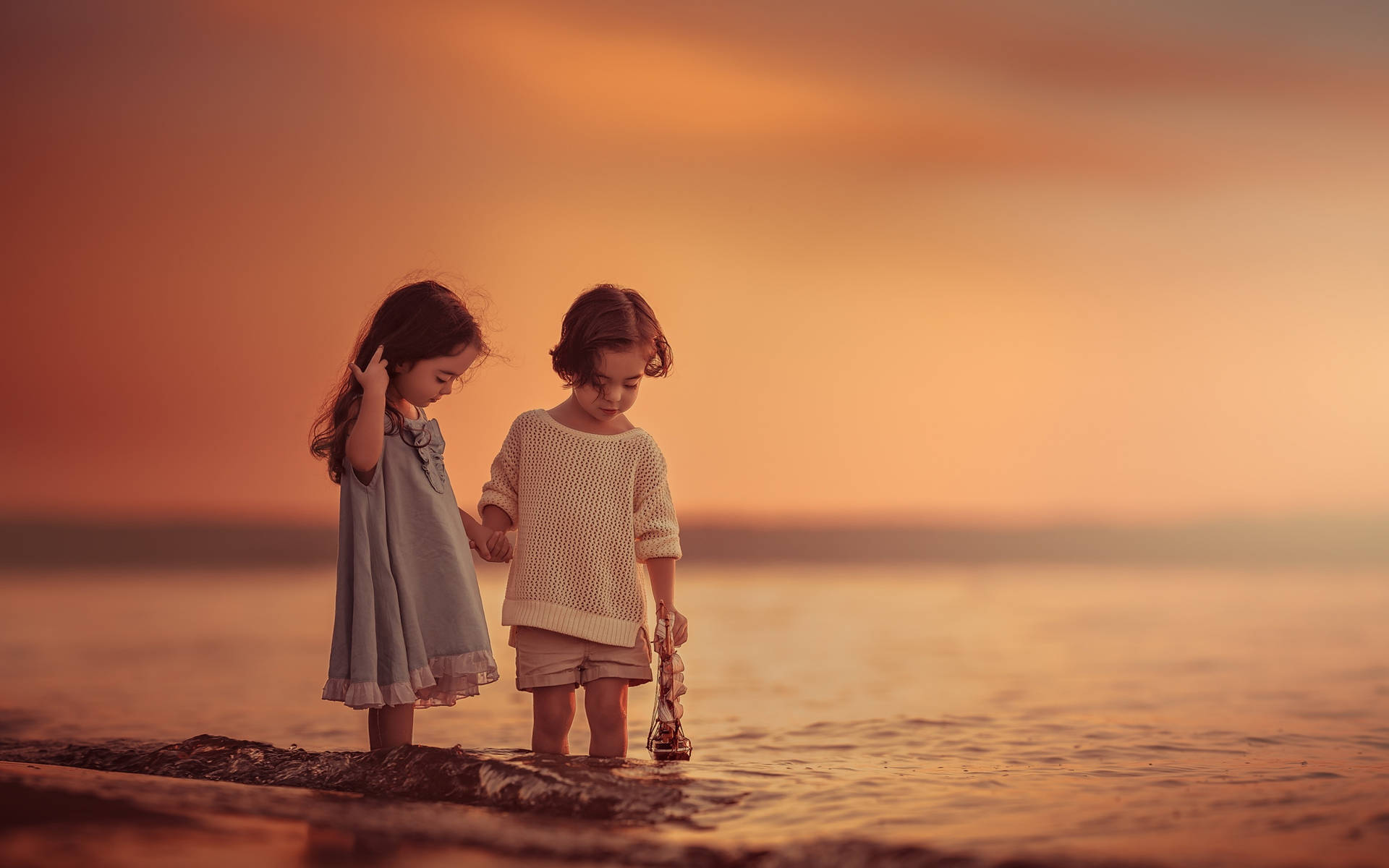 Children Taking A Dip In The Water Background