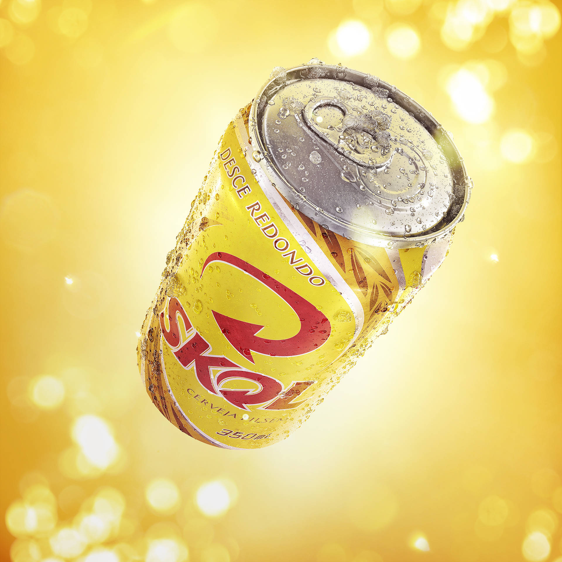 Chilled Skol Beer Can In A Vibrant Yellow Background