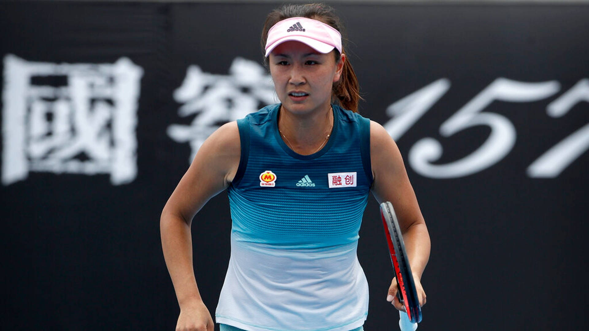 Chinese Pro Tennis Player Shuai Peng In Action Background