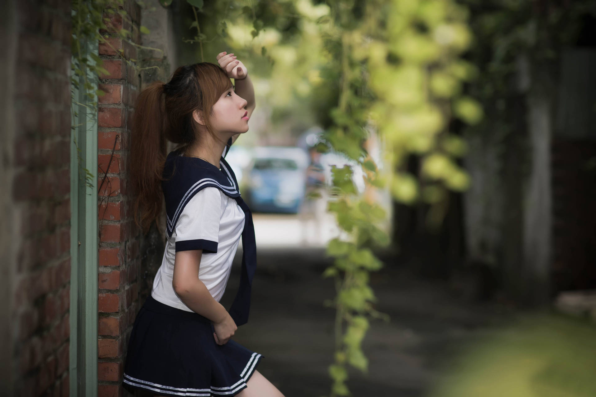 Chinese Woman Posing On Wall