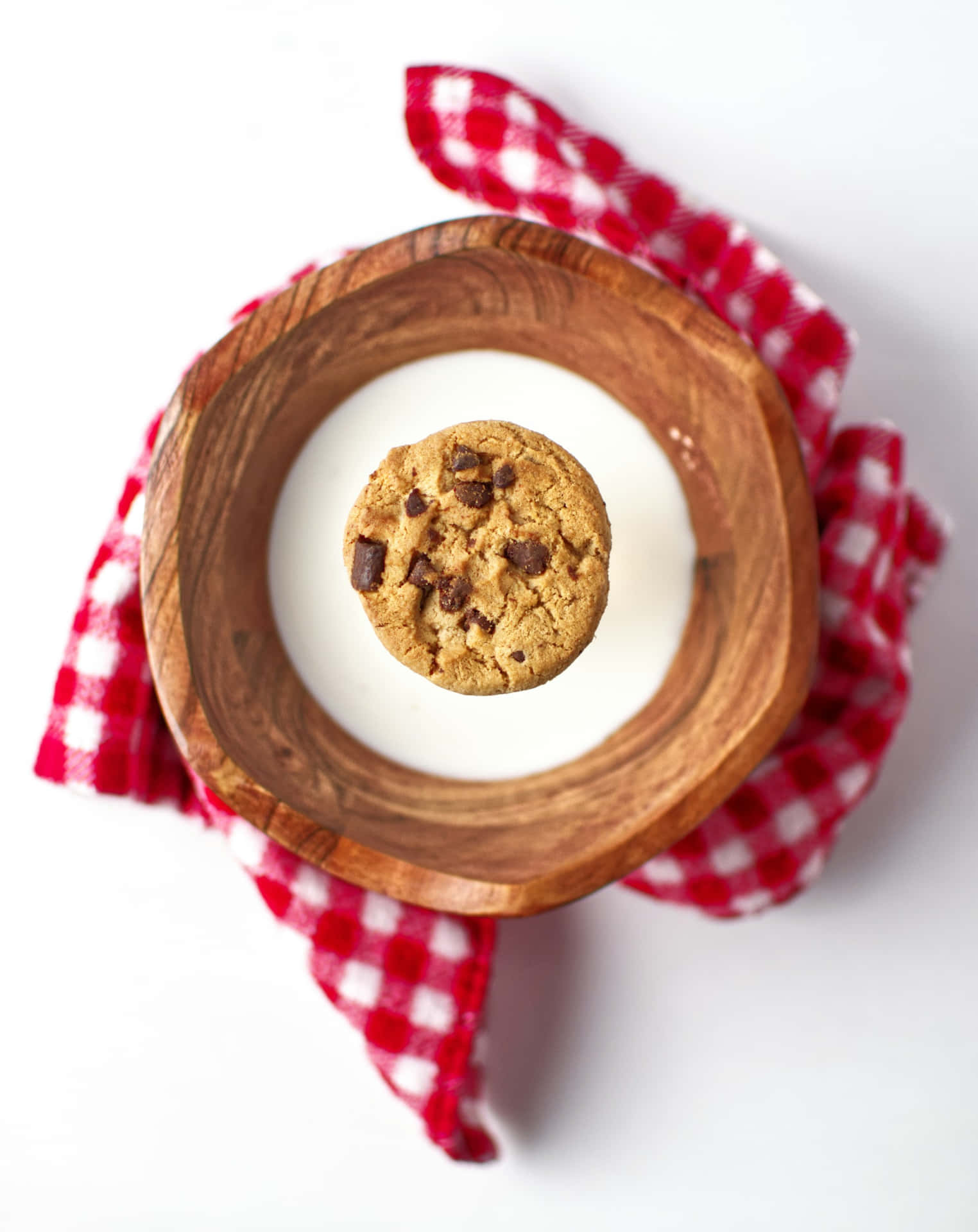 Chocolate Chip Cookieon Milk Glass Background