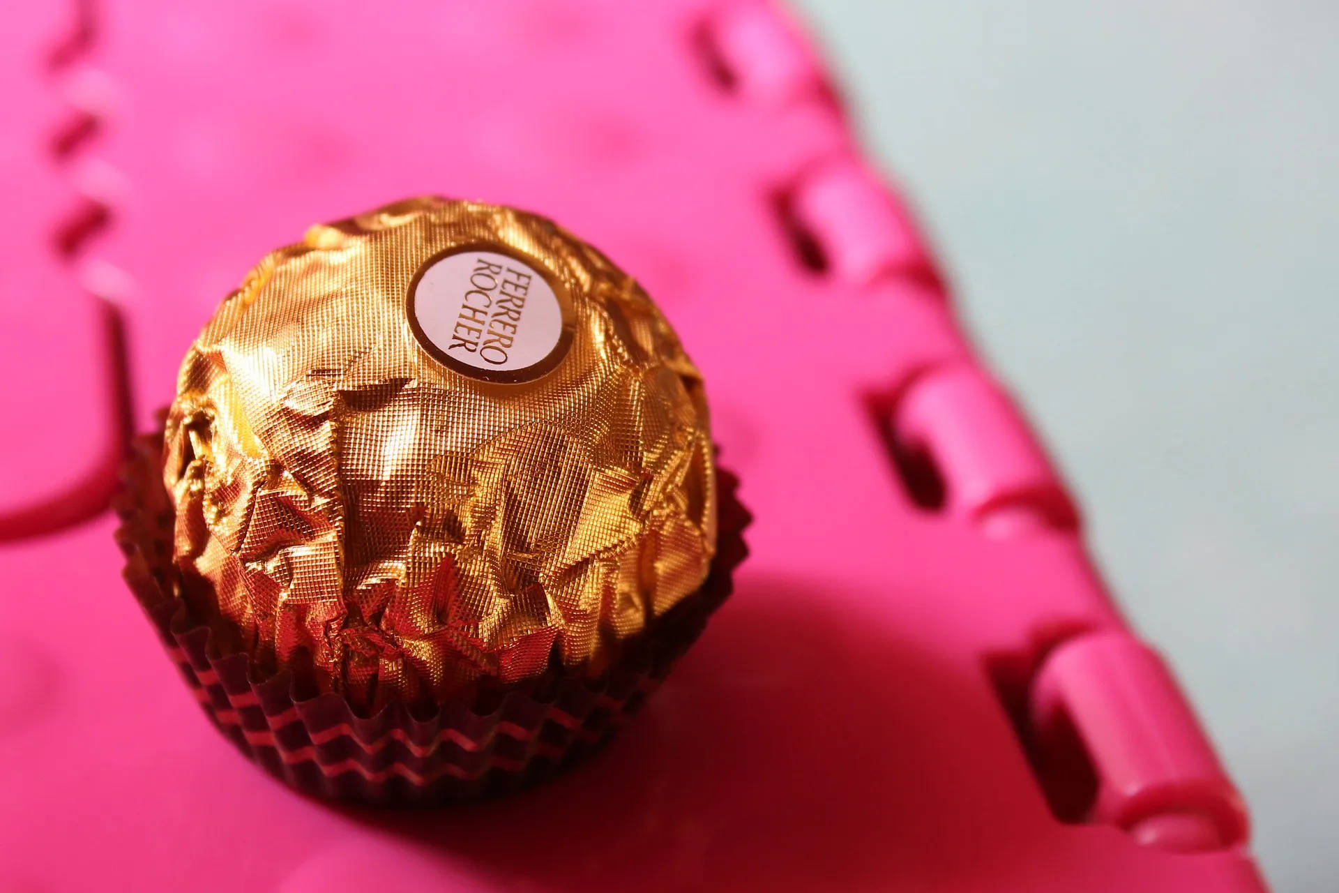 Chocolate In Gold Foil Background