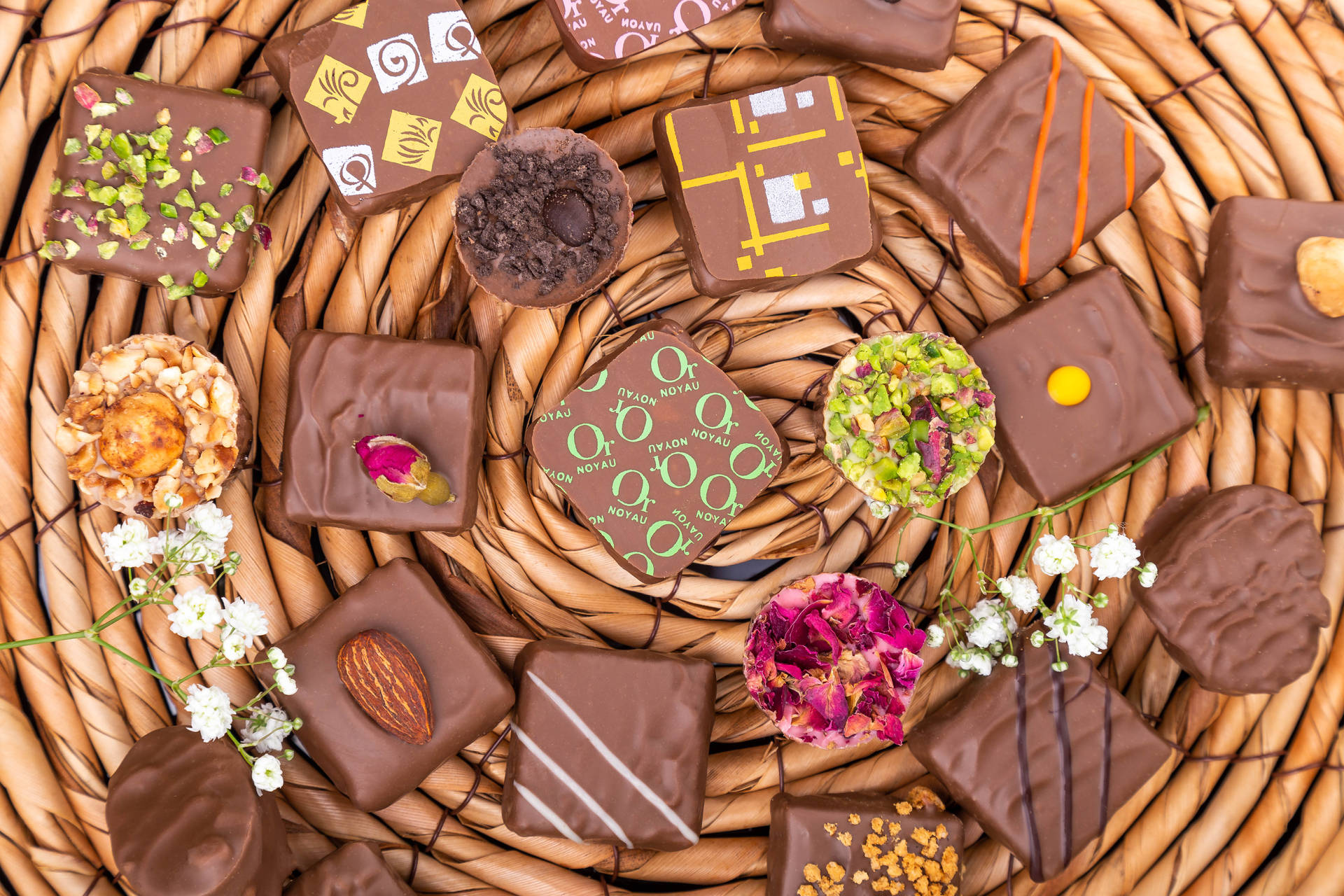 Chocolates With Assorted Flowers Background