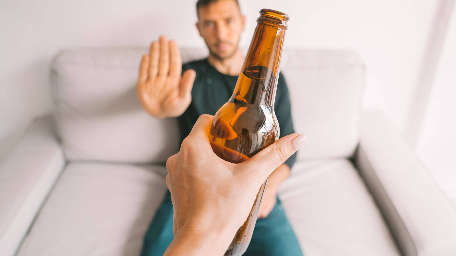 Choosing Sobriety - Man Rejecting Alcohol Background