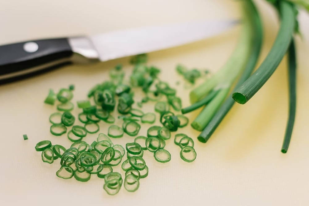 Chopped Spring Onion With Knife Background