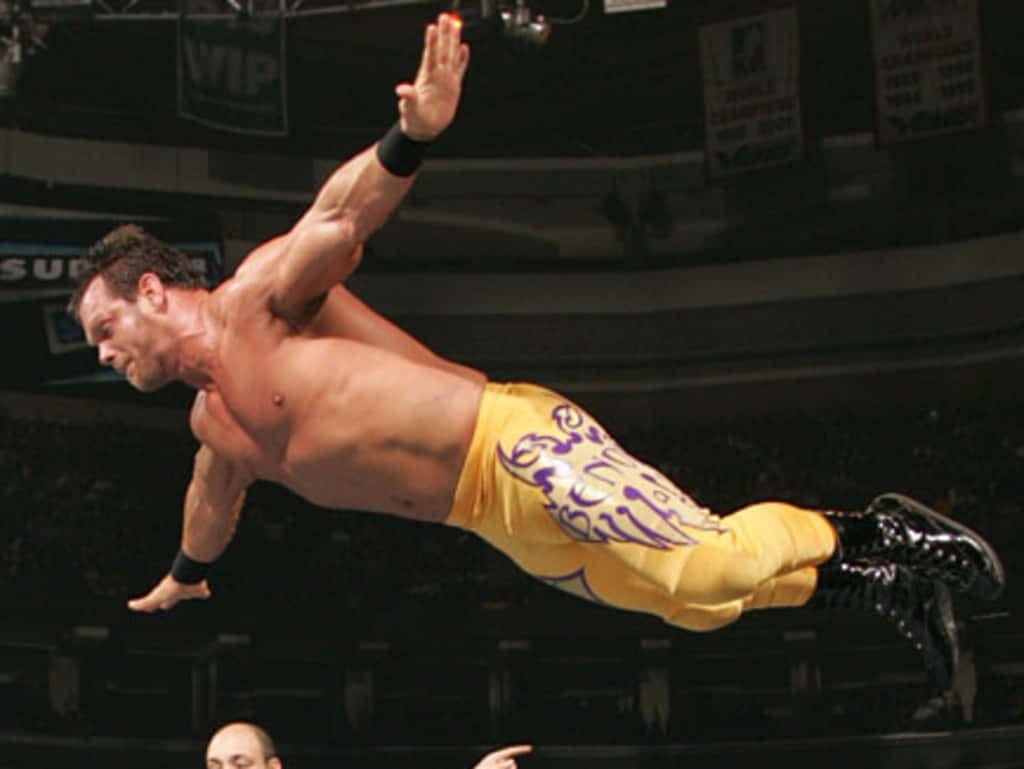 Chris Benoit Masterful Mid-air Leap Background