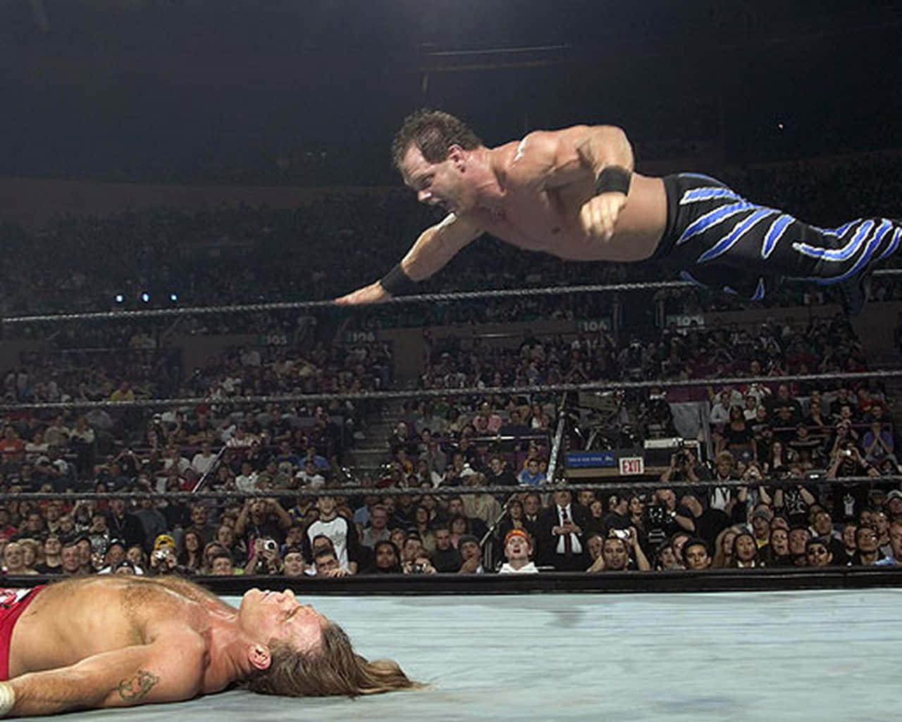 Chris Benoit Mid-air Diving Headbutt Background
