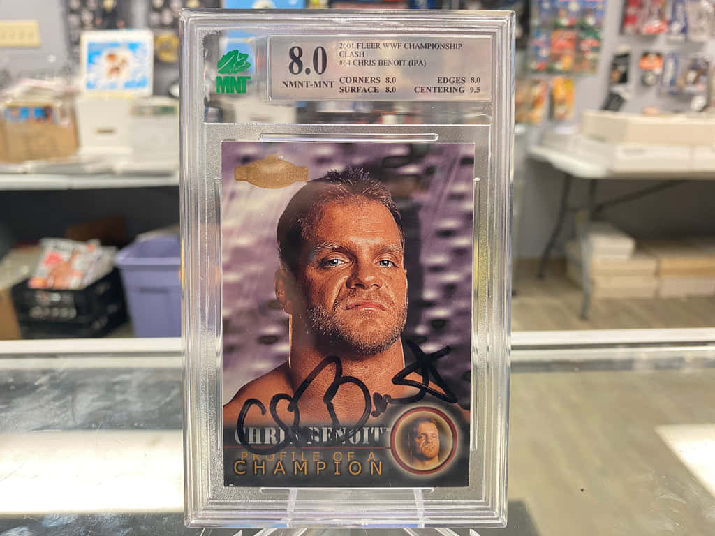 Chris Benoit Posing With Championship Belt Background