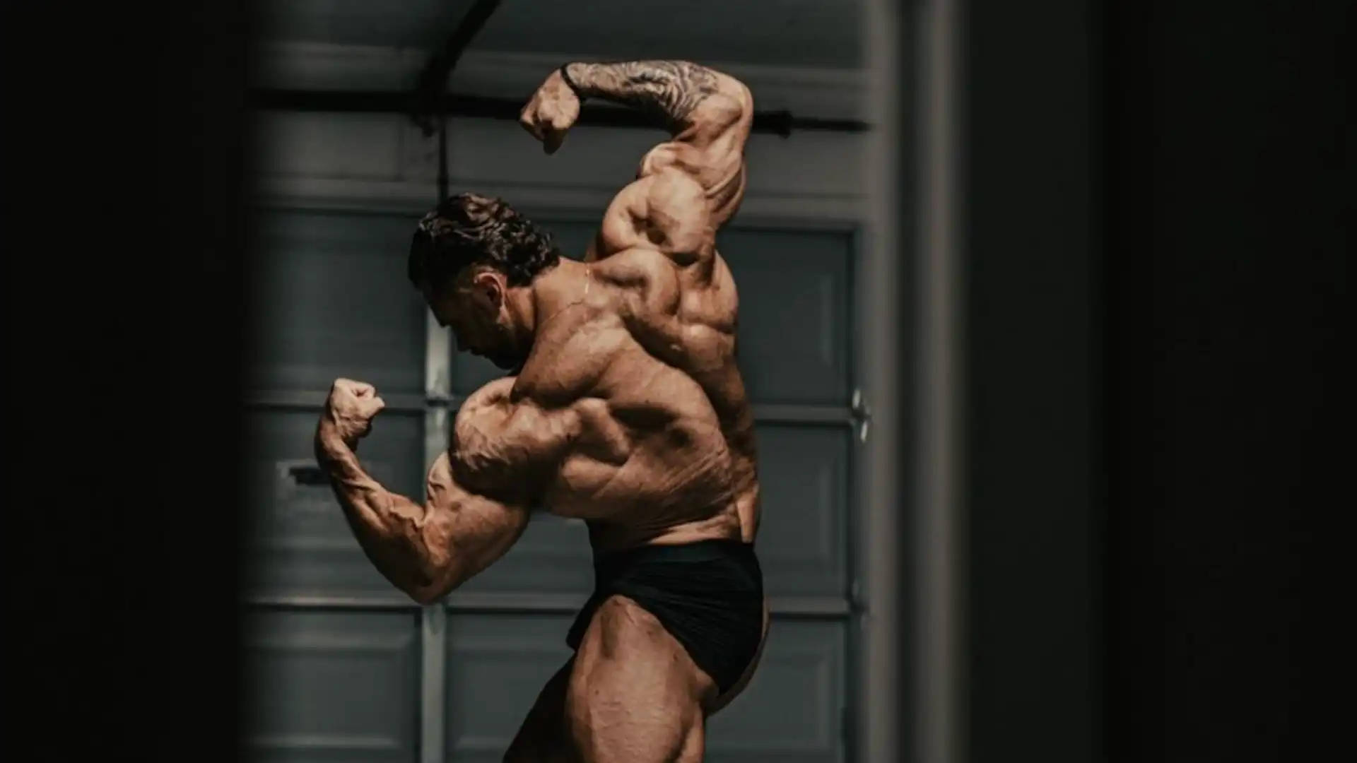 Chris Bumstead Flexing Back Muscles Background