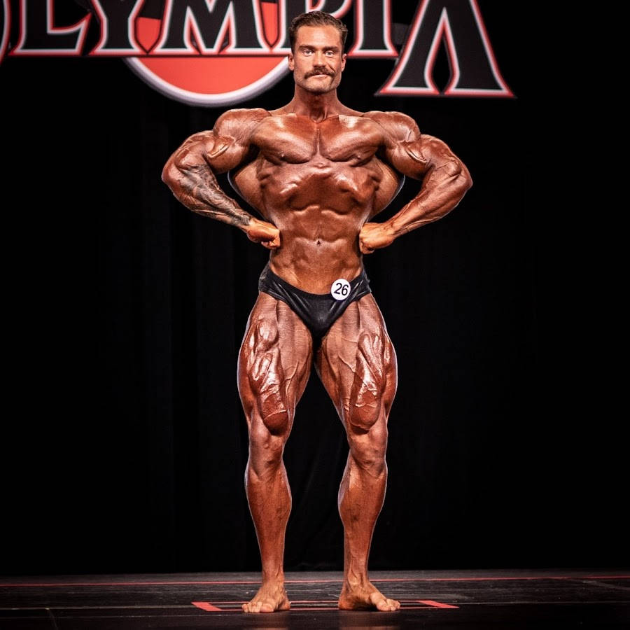 Chris Bumstead Front Lat Spread Olympia Background