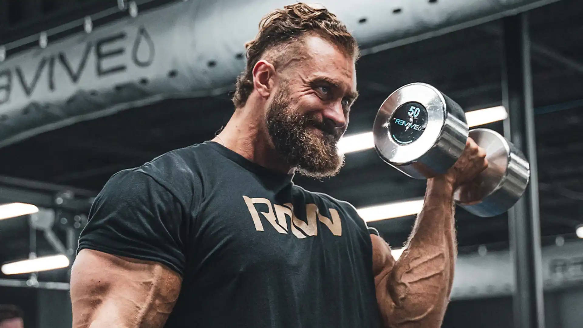 Chris Bumstead Lifting Heavy Dumbbell Background