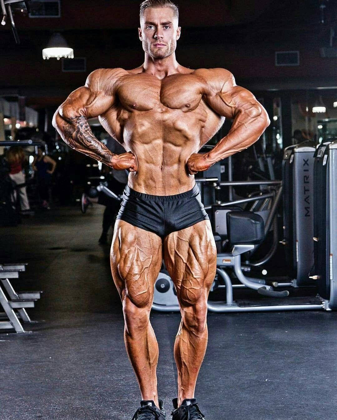 Chris Bumstead Rear Lat Spread Pose Background