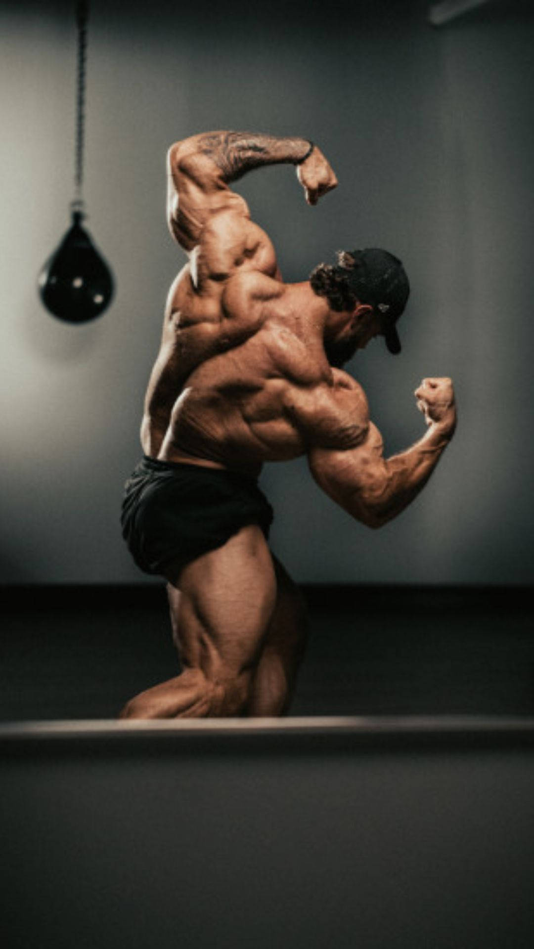 Chris Bumstead Speed Bag In Backdrop Background