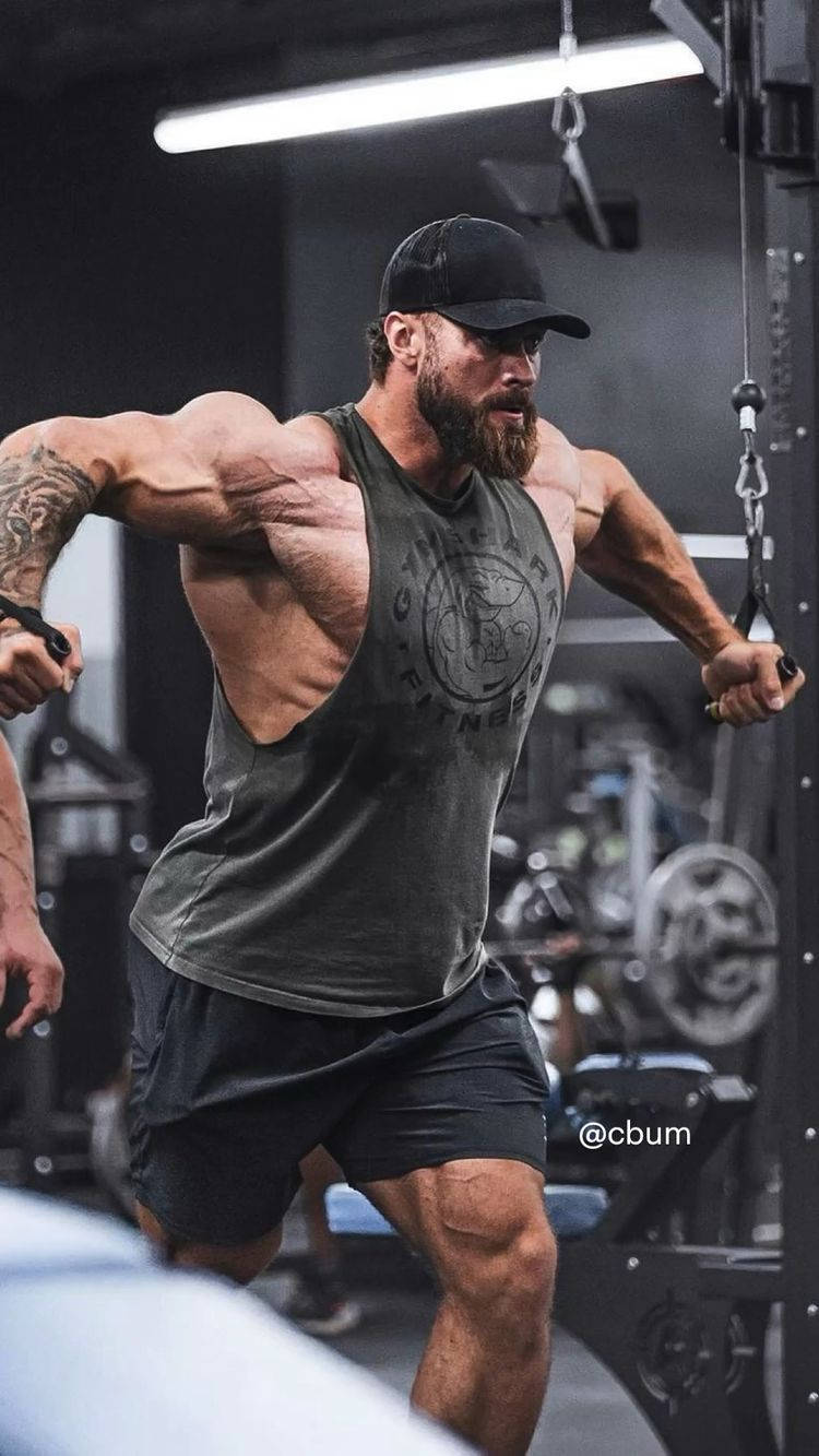 Chris Bumstead Using Cable Gym Equipment Background