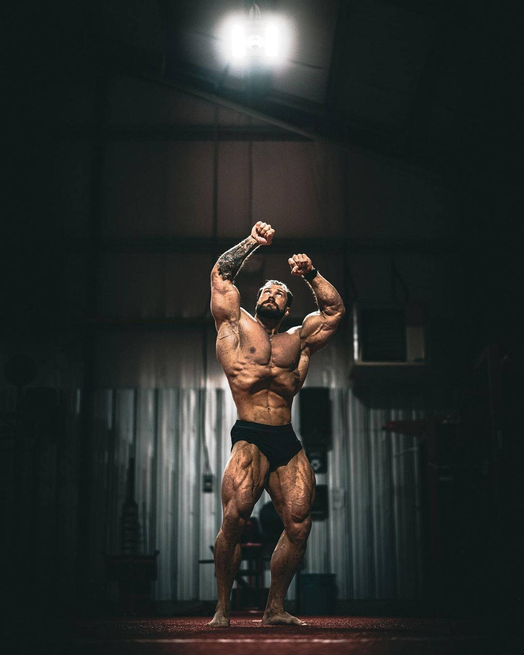 Chris Bumstead Vacuum Bodybuilding Pose Background