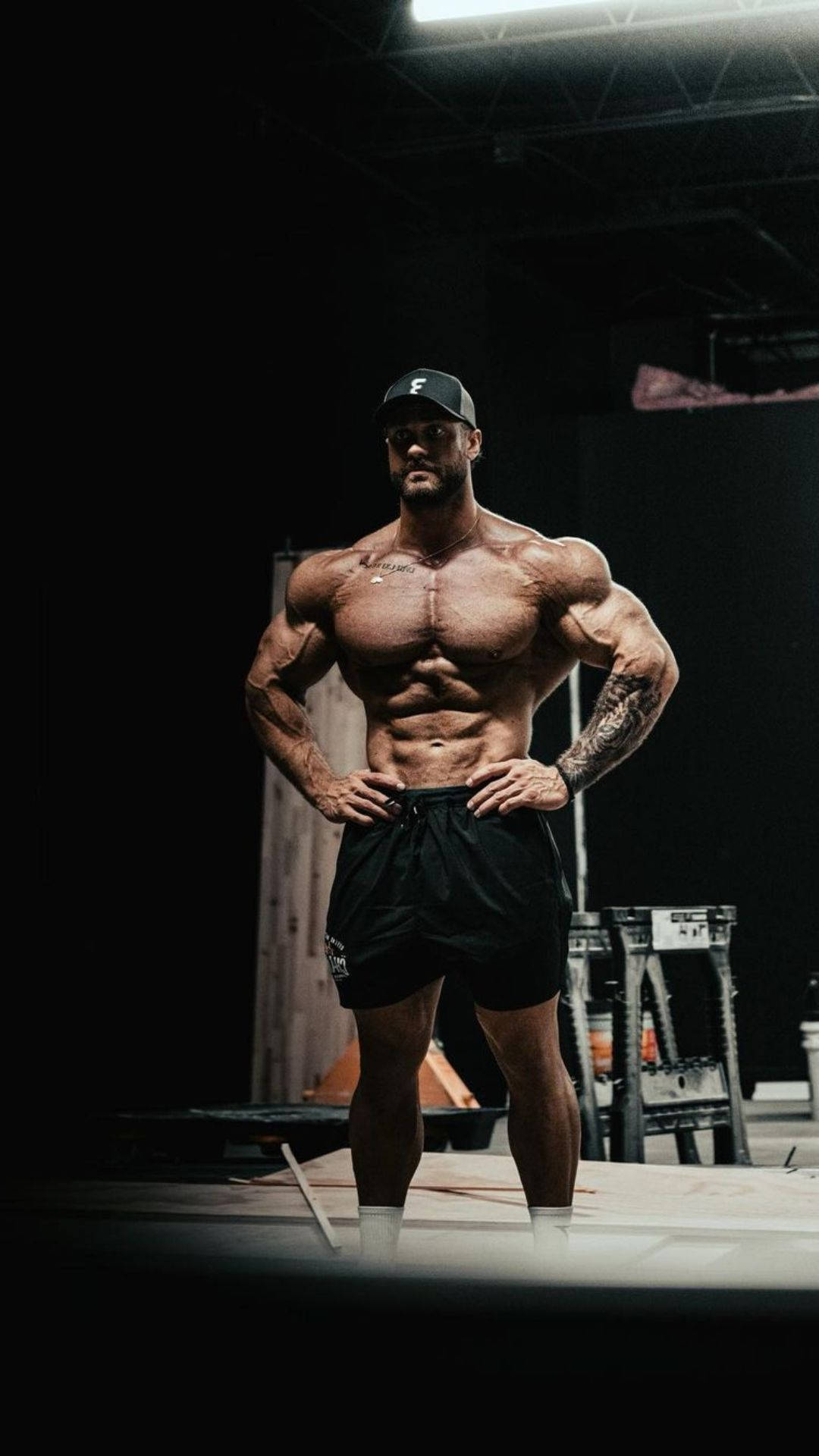 Chris Bumstead With Black Shorts Background