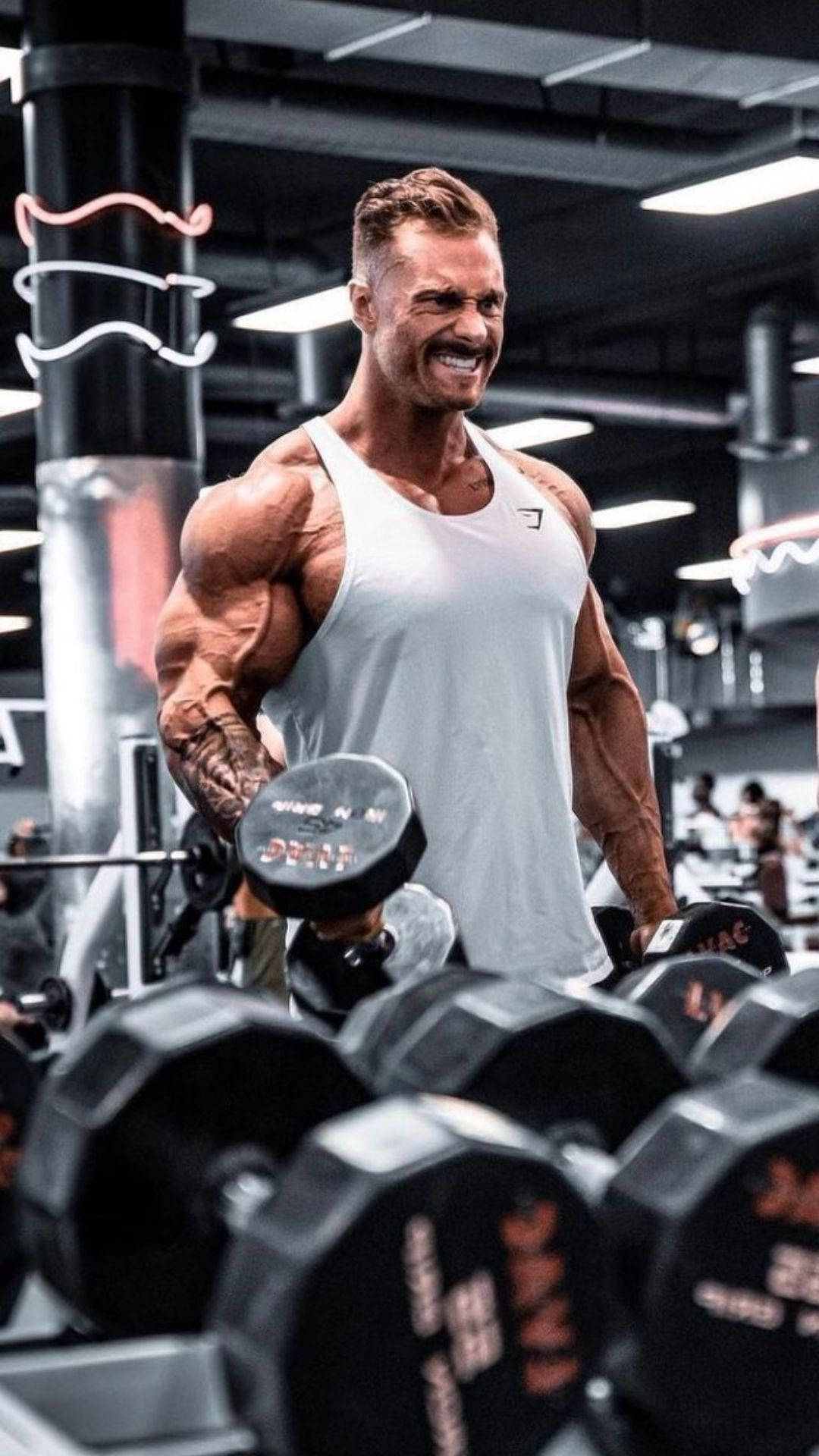 Chris Bumstead With White Tank Top Background