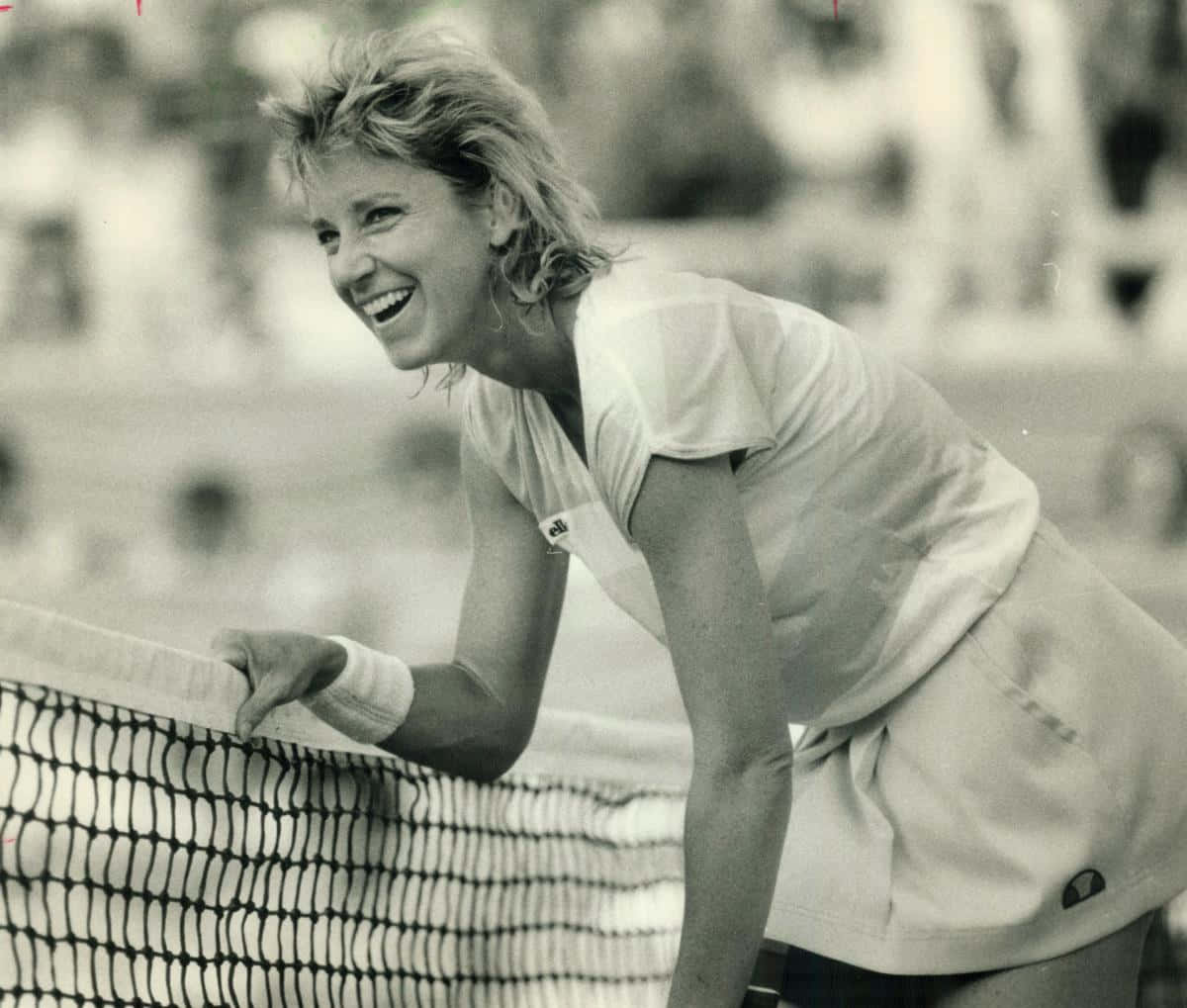 Chris Evert Holding The Net Background